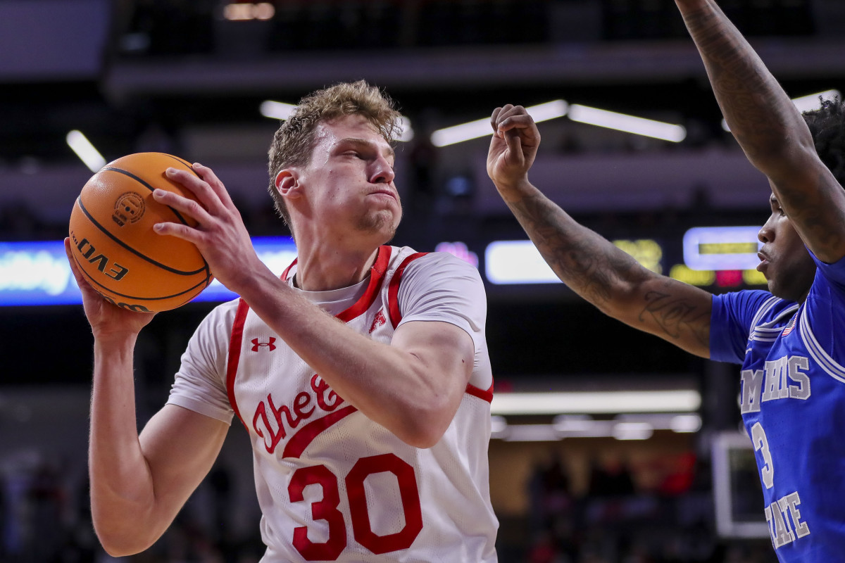 Jan 22, 2023; Cincinnati, Ohio, USA; Cincinnati Bearcats forward Viktor Lakhin (30) drives to the basket against Memphis Tigers guard Kendric Davis (3) in the first half at Fifth Third Arena. Mandatory Credit: Katie Stratman-USA TODAY Sports